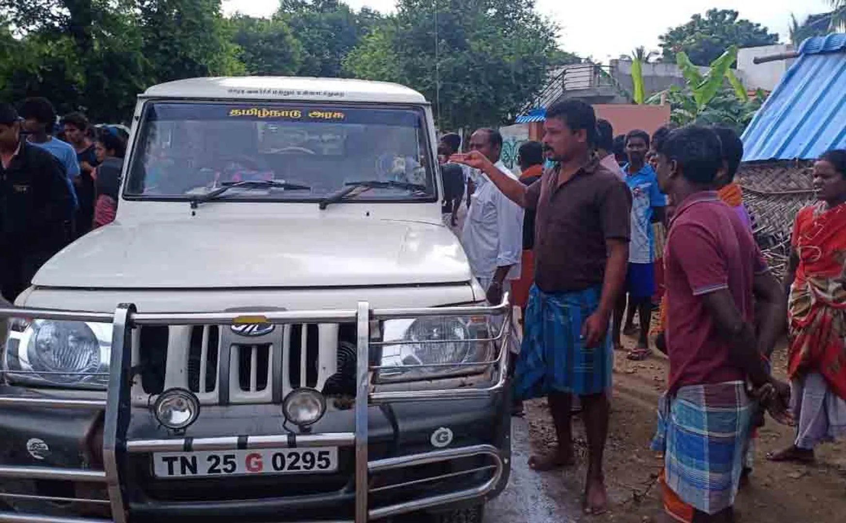 van surrounded by people